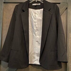 Black cotton blend blazer. Very stylish. Size Medium.